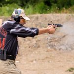 Shooting competitor firing a firearm